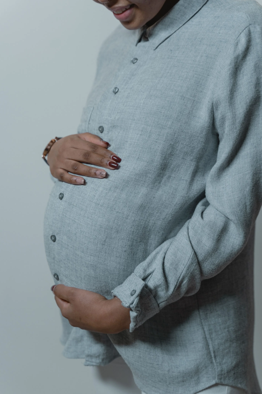Pregnant lady holding her belly